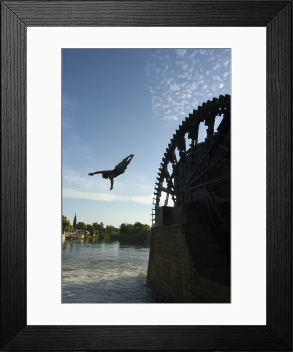 Framed Print : Man diving off water wheel Framed Print : Man diving off water wheel