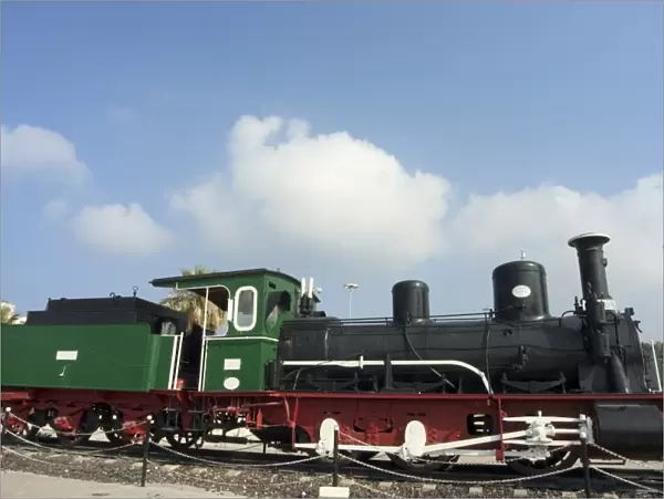 Steam train displayed outside station