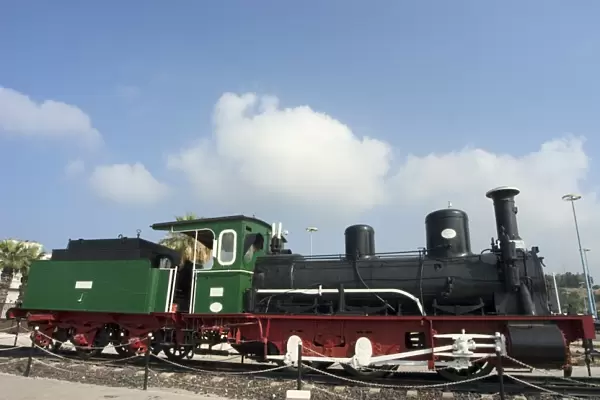 Steam train displayed outside station