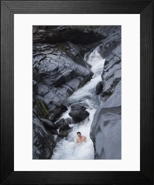 Framed Print : Man enjoying natural hot river water of Tona hotspring bath resort Framed Print : Man enjoying natural hot river water of Tona hotspring bath resort