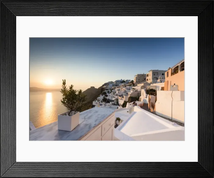 Framed Print : Sunset over the Aegean Sea seen from a terrace of the typical Greek village of Firostefani Framed Print : Sunset over the Aegean Sea seen from a terrace of the typical Greek village of Firostefani