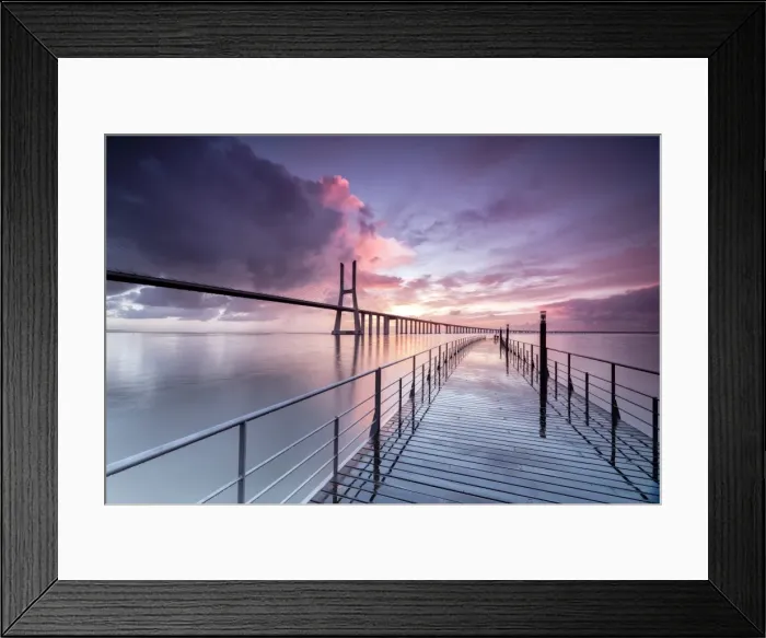 Framed Print : Sunrise colors the clouds reflected in Tagus River and frame the Vasco da Gama bridge in Lisbon Framed Print : Sunrise colors the clouds reflected in Tagus River and frame the Vasco da Gama bridge in Lisbon