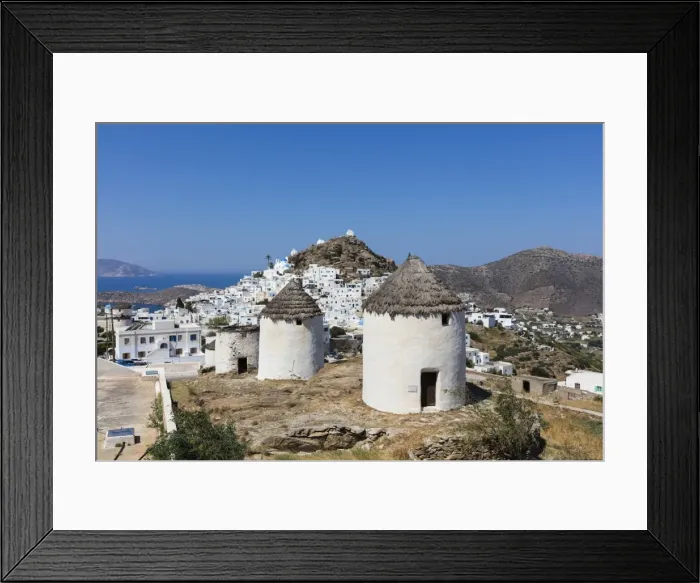 Framed Print : A typical Greek village perched on a rock with white and blue houses and quaint windmills Framed Print : A typical Greek village perched on a rock with white and blue houses and quaint windmills