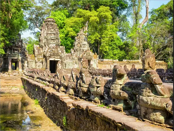 West gate and Naga bridge at Prasat Preah Khan temple ruins, Angkor, UNESCO World Heritage Site