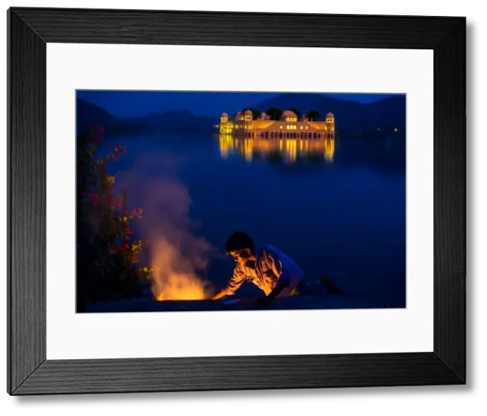 Framed Print : Boy cooking at twilight by the Jal Mahal Floating Lake Palace, Jaipur, Rajasthan Framed Print : Boy cooking at twilight by the Jal Mahal Floating Lake Palace, Jaipur, Rajasthan