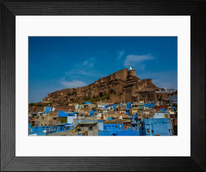 Framed Print : Mehrangarh Fort towering over the blue rooftops in Jodhpur, the Blue City, Rajasthan Framed Print : Mehrangarh Fort towering over the blue rooftops in Jodhpur, the Blue City, Rajasthan
