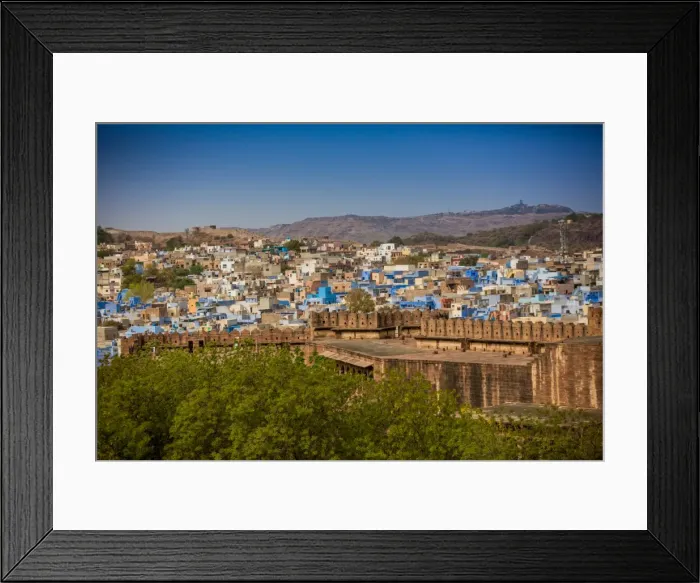 Framed Print : The city wall of Mehrangarh Fort towering over the blue rooftops in Jodhpur, the Blue City Framed Print : The city wall of Mehrangarh Fort towering over the blue rooftops in Jodhpur, the Blue City