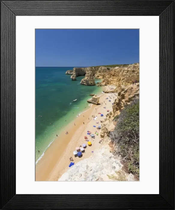 Framed Print : Tourists on sandy beach Praia da Marinha surrounded by turquoise ocean, Caramujeira Framed Print : Tourists on sandy beach Praia da Marinha surrounded by turquoise ocean, Caramujeira