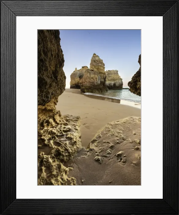 Framed Print : A sea cave frames the ocean and the imposing cliffs at dawn, Praia da Rocha, Portimao Framed Print : A sea cave frames the ocean and the imposing cliffs at dawn, Praia da Rocha, Portimao