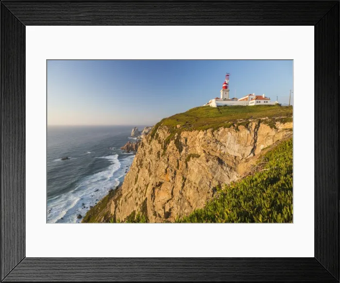 Framed Print : The Cabo da Roca lighthouse overlooks the promontory towards the Atlantic Ocean at sunset Framed Print : The Cabo da Roca lighthouse overlooks the promontory towards the Atlantic Ocean at sunset