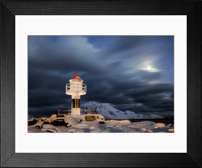 Framed Print : Lighthouse and full moon in the Arctic night with the village of Reine in the background Framed Print : Lighthouse and full moon in the Arctic night with the village of Reine in the background