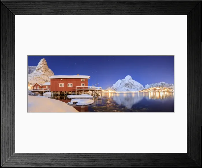 Framed Print : Panoramic view of snowy peaks and the frozen sea on a starry winter night, Reinevagen Bay Framed Print : Panoramic view of snowy peaks and the frozen sea on a starry winter night, Reinevagen Bay
