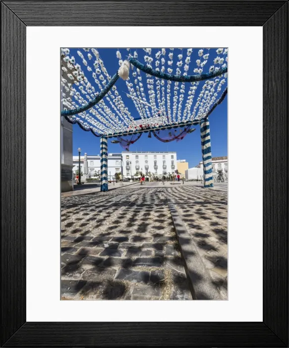 Framed Print : Colors and decoration in the pedestrian centre of Tavira on a sunny summer day, Faro Framed Print : Colors and decoration in the pedestrian centre of Tavira on a sunny summer day, Faro