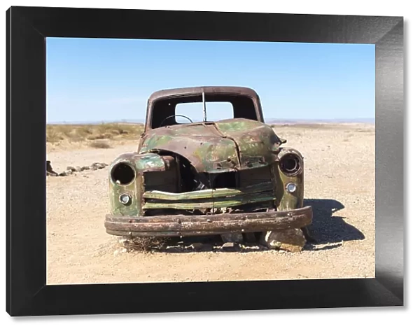 A rusty abandoned car in the desert near Aus in southern Namibia, Africa