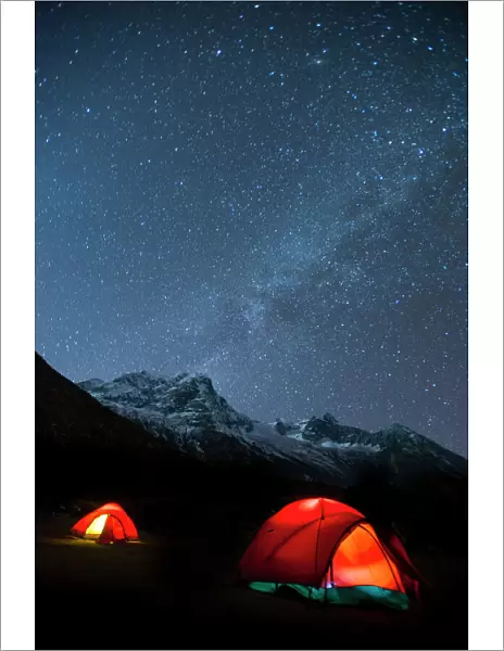 Glowing tents at Samogaon on the Manaslu circuit trek, Himalayas, Nepal, Asia