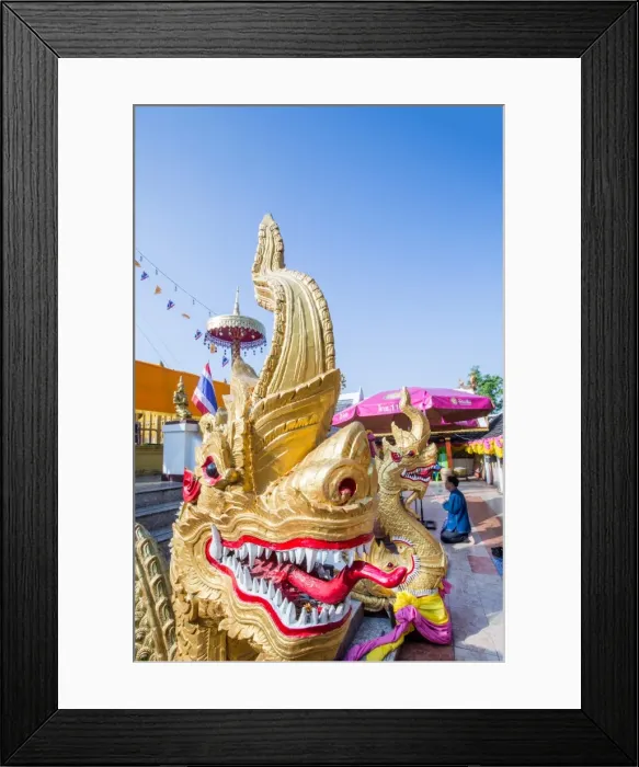 Framed Print : Naga head staircase and devotee at Doi Kham (Wat Phra That Doi Kham) (Temple of Framed Print : Naga head staircase and devotee at Doi Kham (Wat Phra That Doi Kham) (Temple of