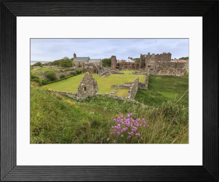 Framed Print : Lindisfarne Priory, early Christian site, and village, elevated view, Holy Island Framed Print : Lindisfarne Priory, early Christian site, and village, elevated view, Holy Island