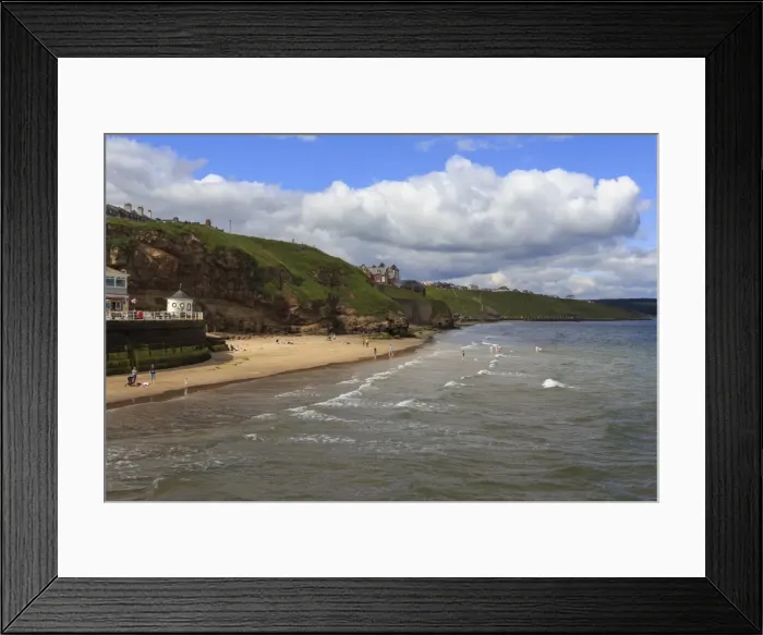 Framed Print : Bathers on West Cliff Beach, backed by grassy cliffs in summer, Whitby, North Yorkshire Framed Print : Bathers on West Cliff Beach, backed by grassy cliffs in summer, Whitby, North Yorkshire