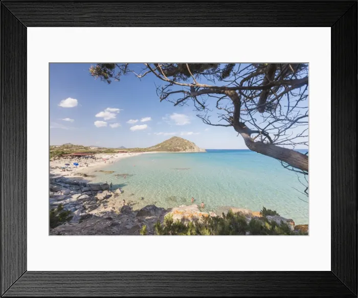 Framed Print : Mediterranean vegetation frames the bay and the turquoise sea of Cala Monte Turno