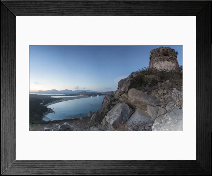 Framed Print : Top view of the bay with sandy beaches and lights of a village at dusk, Porto Giunco