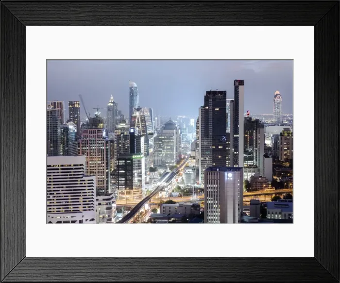 Framed Print : Skyline showing the Skytrain and city centre around Sukhumvit Road and Chit Lom, Bangkok Framed Print : Skyline showing the Skytrain and city centre around Sukhumvit Road and Chit Lom, Bangkok