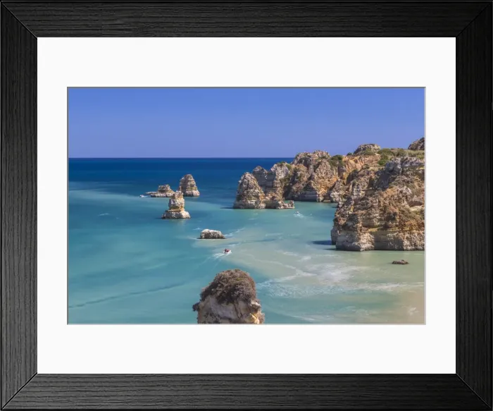 Framed Print : The turquoise water of the Atlantic Ocean and cliffs surrounding Praia Dona Ana beach Framed Print : The turquoise water of the Atlantic Ocean and cliffs surrounding Praia Dona Ana beach