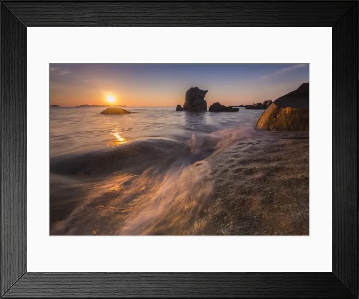 Framed Print : Waves crashing on cliffs under the fiery sky at sunrise, Punta Molentis, Villasimius