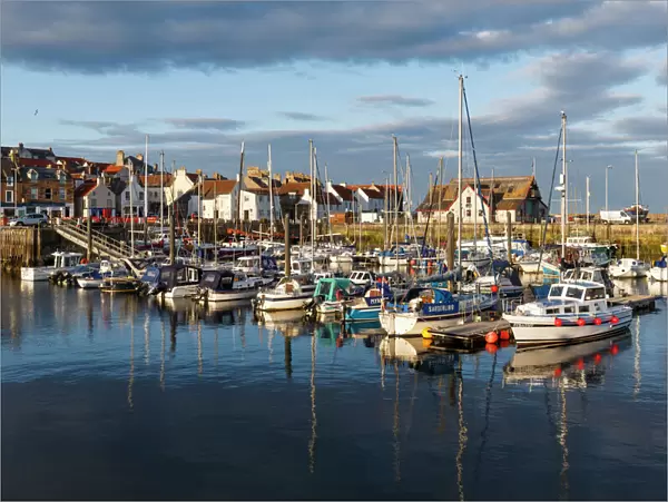 Sailing boats at sunset in the harbour at Anstruther, Fife, East Neuk, Scotland, United Kingdom