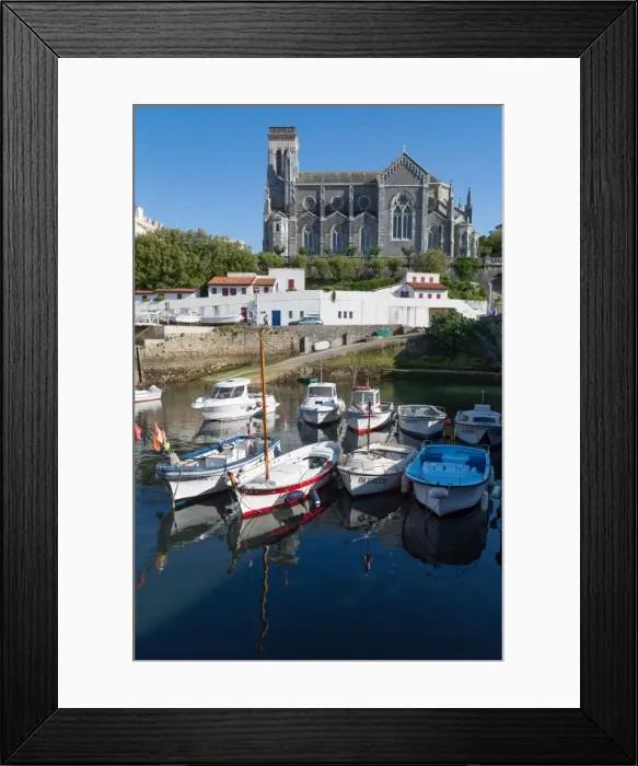 Framed Print : Small port with traditional fishing boats and Eglise Sainte Eugenie in Biarritz Framed Print : Small port with traditional fishing boats and Eglise Sainte Eugenie in Biarritz