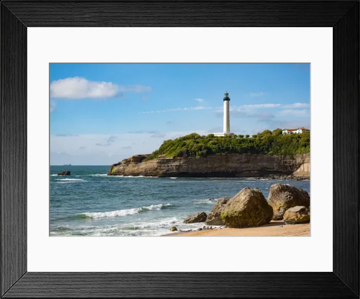 Framed Print : Rocks on the sandy beach and the lighthouse in Biarritz, Pyrenees Atlantiques, Aquitaine Framed Print : Rocks on the sandy beach and the lighthouse in Biarritz, Pyrenees Atlantiques, Aquitaine