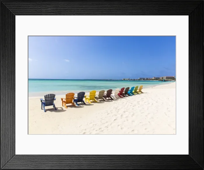 Framed Print : A row of colourful wooden deckchairs on Palm Beach, Aruba, Netherlands Antilles, Caribbean Framed Print : A row of colourful wooden deckchairs on Palm Beach, Aruba, Netherlands Antilles, Caribbean
