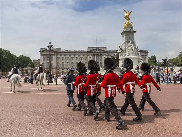 Changing the Guard at Buckingham Palace, New Guard marching, colourful spectacle