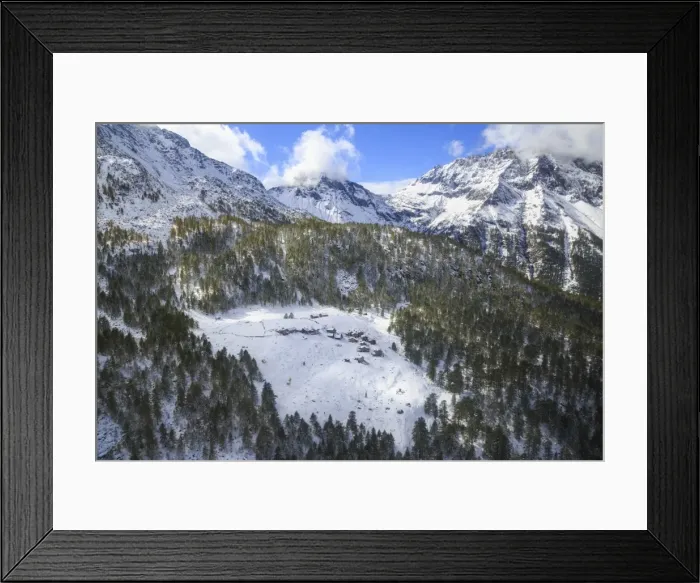 Framed Print : Aerial view of the alpine village of Laguzzola framed by woods and snowy peaks, Spluga Valley Framed Print : Aerial view of the alpine village of Laguzzola framed by woods and snowy peaks, Spluga Valley