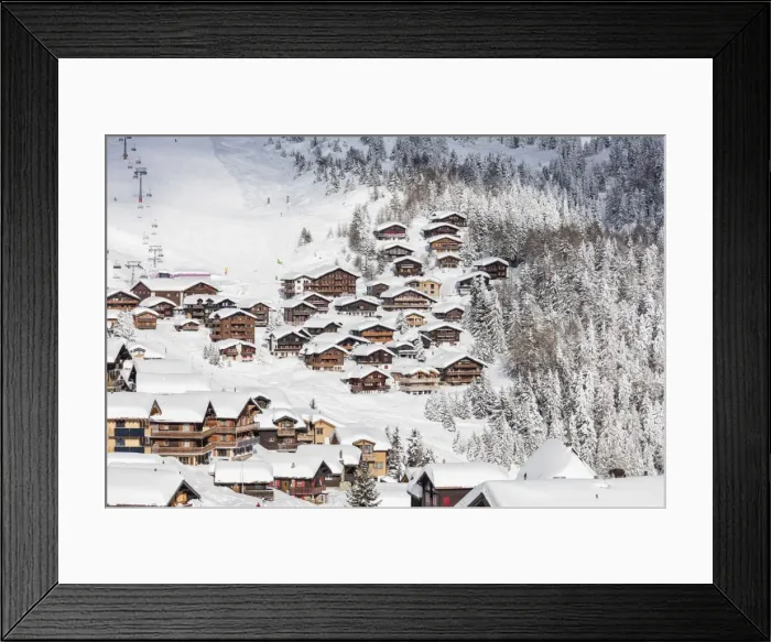 Framed Print : Snowy woods frame the typical alpine village and ski resort, Bettmeralp, district of Raron Framed Print : Snowy woods frame the typical alpine village and ski resort, Bettmeralp, district of Raron