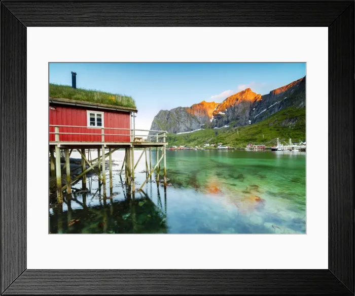 Framed Print : Typical house of fishermen called Rorbu lit up by midnight sun, Reine, Nordland county Framed Print : Typical house of fishermen called Rorbu lit up by midnight sun, Reine, Nordland county