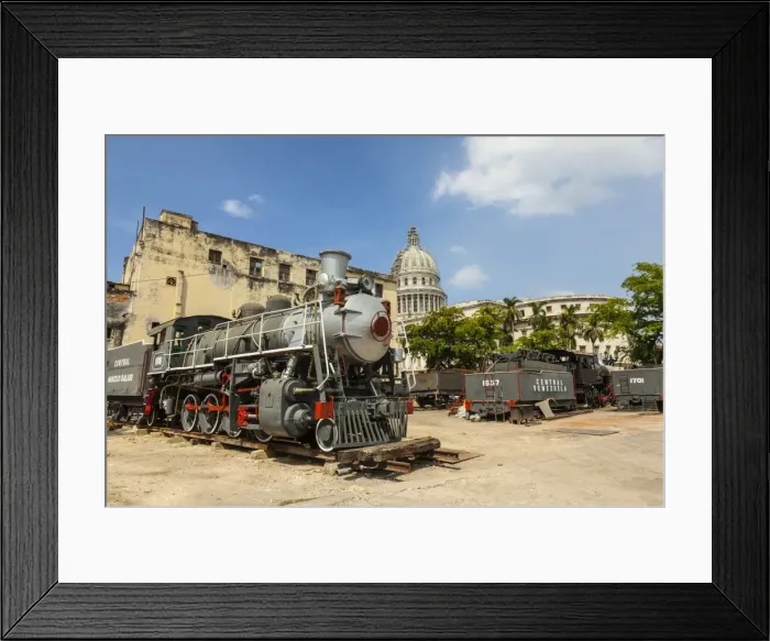 Framed Print : A vintage steam train in a restoration yard with the dome of the former Parliament Framed Print : A vintage steam train in a restoration yard with the dome of the former Parliament