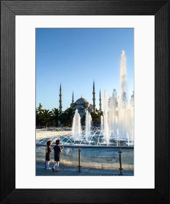 Framed Print : Two young Turkish girls pointing to the Blue Mosque, UNESCO World Heritage Site Framed Print : Two young Turkish girls pointing to the Blue Mosque, UNESCO World Heritage Site