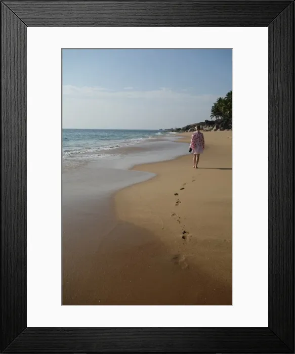 Framed Print : Woman walking leaving footprints on deserted beach, Niraamaya, Kovalam, Kerala, India Framed Print : Woman walking leaving footprints on deserted beach, Niraamaya, Kovalam, Kerala, India