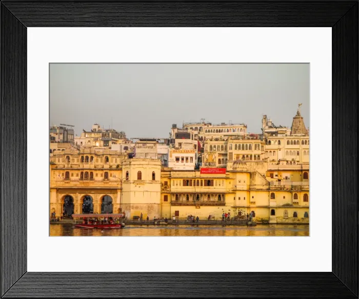 Framed Print : Old building facades, boat in foreground, City Palace side, Lake Pichola, Udaipur Framed Print : Old building facades, boat in foreground, City Palace side, Lake Pichola, Udaipur