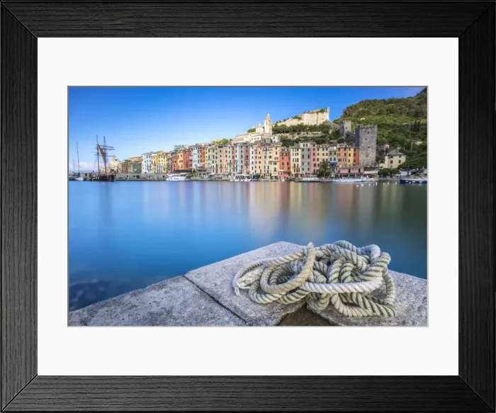 Framed Print : View from the pier of blue sea which frames the typical colored houses of Portovenere Framed Print : View from the pier of blue sea which frames the typical colored houses of Portovenere
