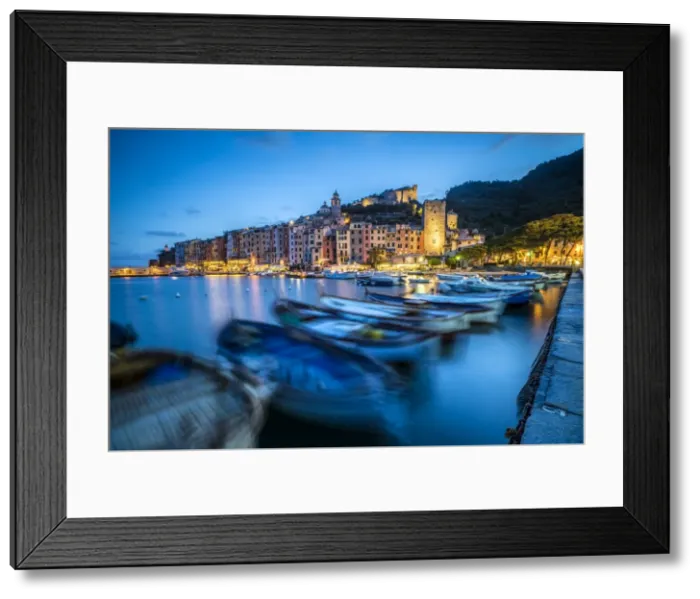 Framed Print : View of blue sea and boats surrounding the colorful village at dusk, Portovenere Framed Print : View of blue sea and boats surrounding the colorful village at dusk, Portovenere