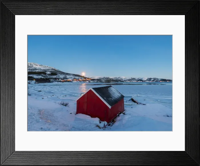 Framed Print : The blue light of dusk on the typical house of fishermen framed by the frozen sea Framed Print : The blue light of dusk on the typical house of fishermen framed by the frozen sea