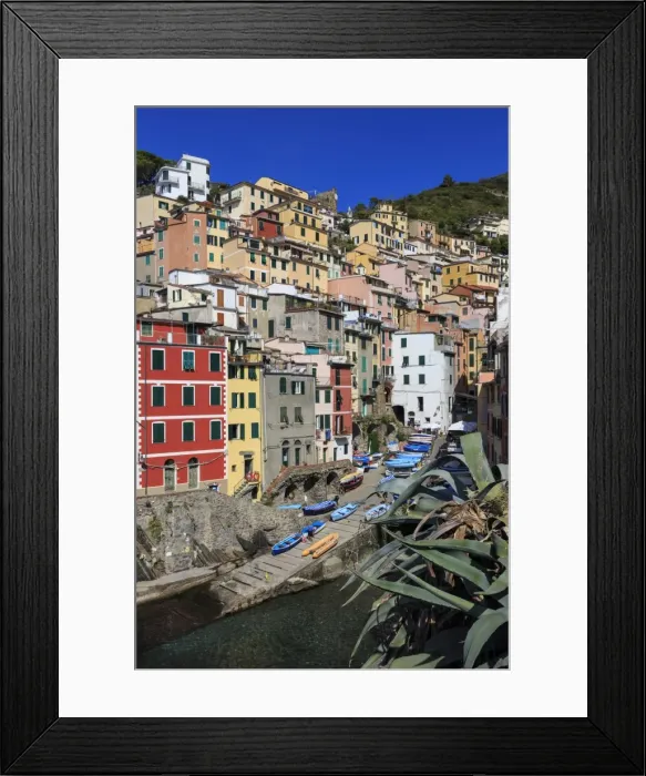 Framed Print : Tiny harbour and medieval houses in steep ravine, Riomaggiore, Cinque Terre, UNESCO Framed Print : Tiny harbour and medieval houses in steep ravine, Riomaggiore, Cinque Terre, UNESCO