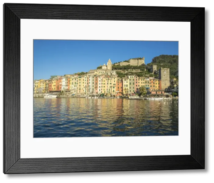 Framed Print : The blue sea frames the typical colored houses of Portovenere, UNESCO World Heritage Site Framed Print : The blue sea frames the typical colored houses of Portovenere, UNESCO World Heritage Site