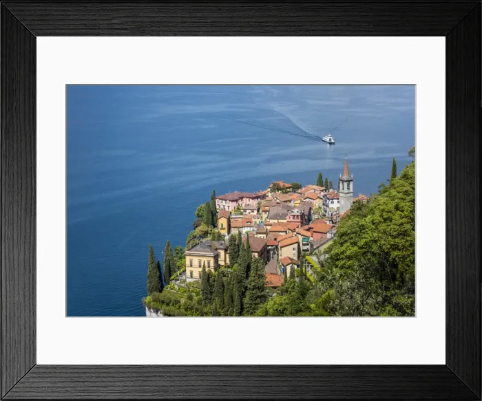 Framed Print : The typical village of Varenna surrounded by the blue water of Lake Como and gardens Framed Print : The typical village of Varenna surrounded by the blue water of Lake Como and gardens