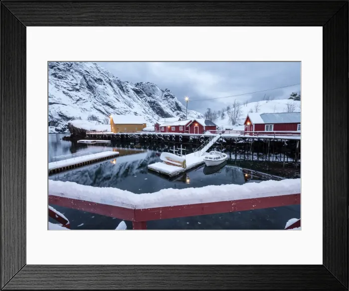 Framed Print : Cold sea and snowy peaks frame the fishing village at dusk, Nusfjord, Nordland, Lofoten Islands Framed Print : Cold sea and snowy peaks frame the fishing village at dusk, Nusfjord, Nordland, Lofoten Islands