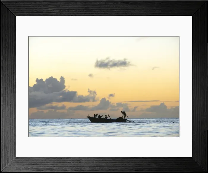Framed Print : Seine fisherman lay their nets from a boat in Castara Bay in Tobago at sunset, Trinidad and Tobago Framed Print : Seine fisherman lay their nets from a boat in Castara Bay in Tobago at sunset, Trinidad and Tobago