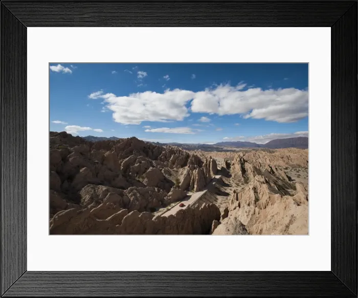 Framed Print : A car passes through the stunning rock formations of the Quebrada de las Flechas Framed Print : A car passes through the stunning rock formations of the Quebrada de las Flechas