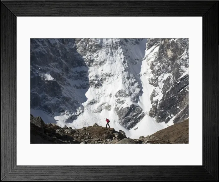 Framed Print : A trekker in the Everest region on the way up to Everest Base Camp walking in front of Cholatse Framed Print : A trekker in the Everest region on the way up to Everest Base Camp walking in front of Cholatse