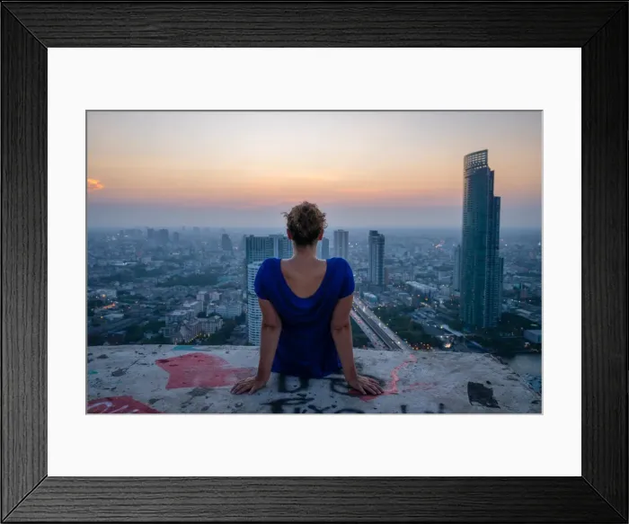 Framed Print : A single woman watching sun set over city skyline at dusk, Bangkok, Thailand, Southeast Asia Framed Print : A single woman watching sun set over city skyline at dusk, Bangkok, Thailand, Southeast Asia